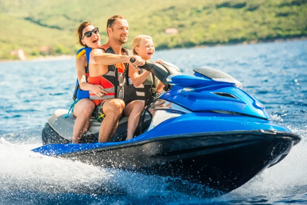 family riding on jetski